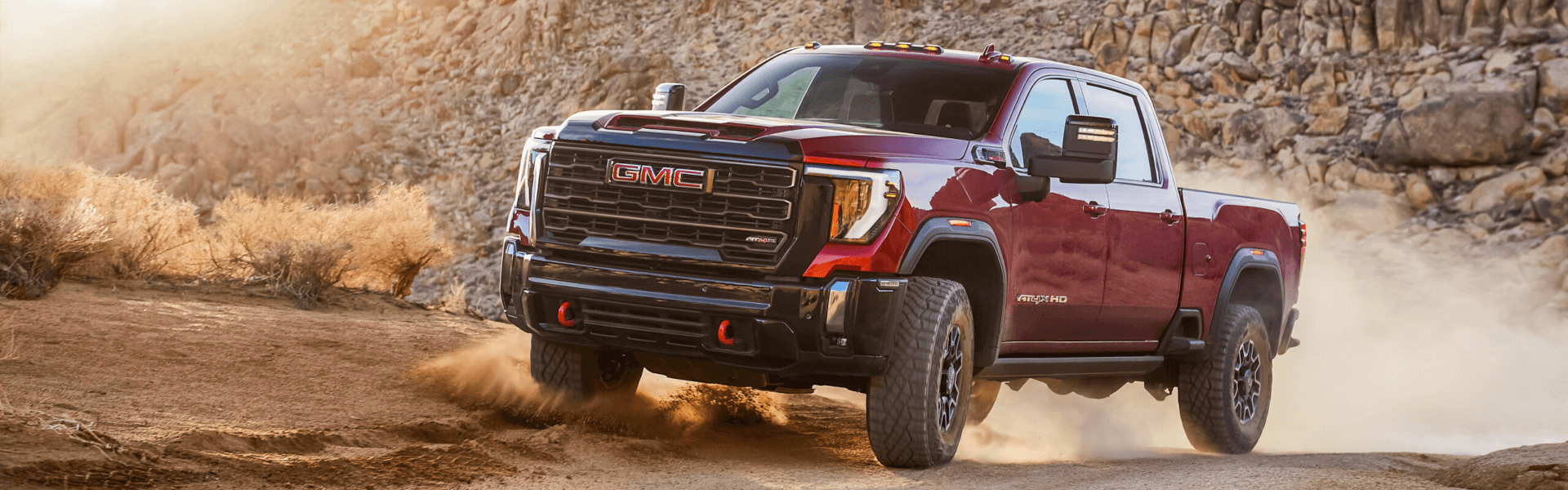 2024 GMC Sierra driving around a canyon
